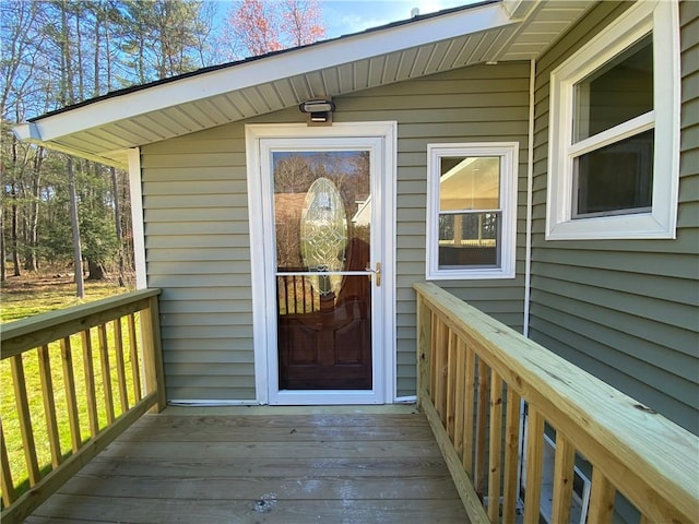 property entrance with a wooden deck