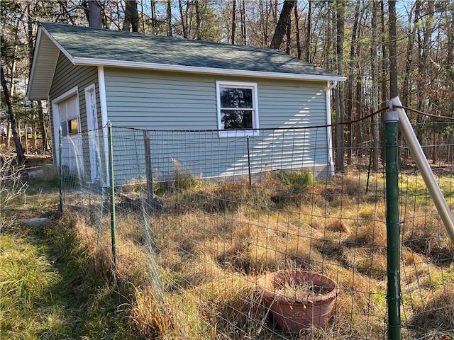 view of side of property with an outbuilding and a garage