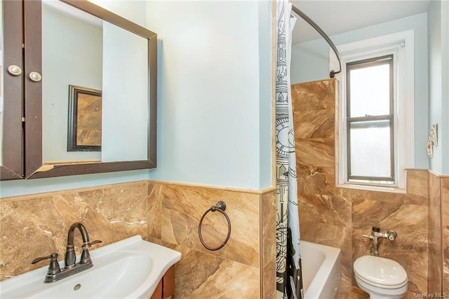 full bathroom featuring vanity, toilet, tile walls, and shower / bath combo with shower curtain