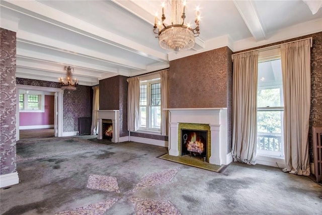 unfurnished living room with carpet flooring, beam ceiling, and a notable chandelier