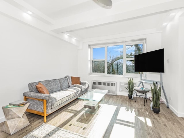 living room featuring light hardwood / wood-style flooring and radiator