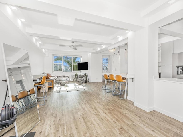 living room with light wood-type flooring and ceiling fan