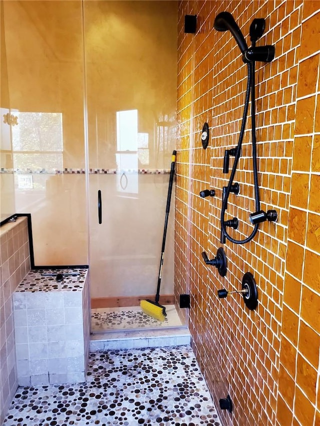 bathroom with a tile shower