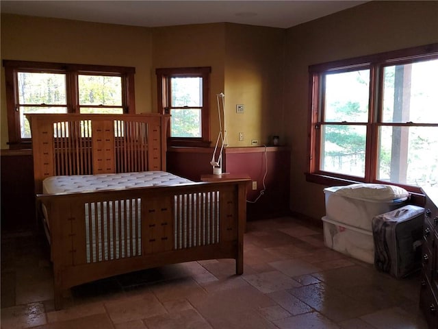 bedroom with multiple windows