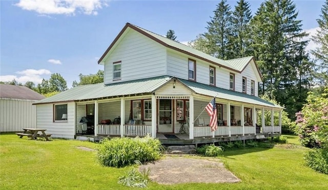 back of property featuring a lawn and a porch