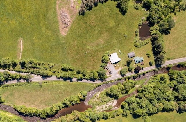 drone / aerial view featuring a rural view and a water view