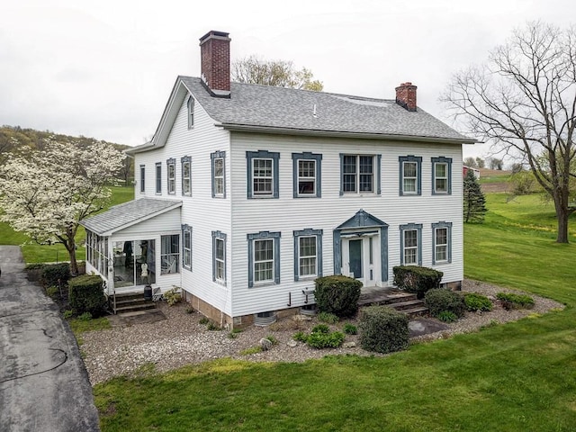 view of home's exterior with a lawn