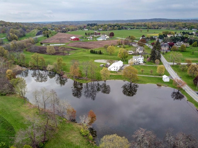 drone / aerial view with a rural view and a water view