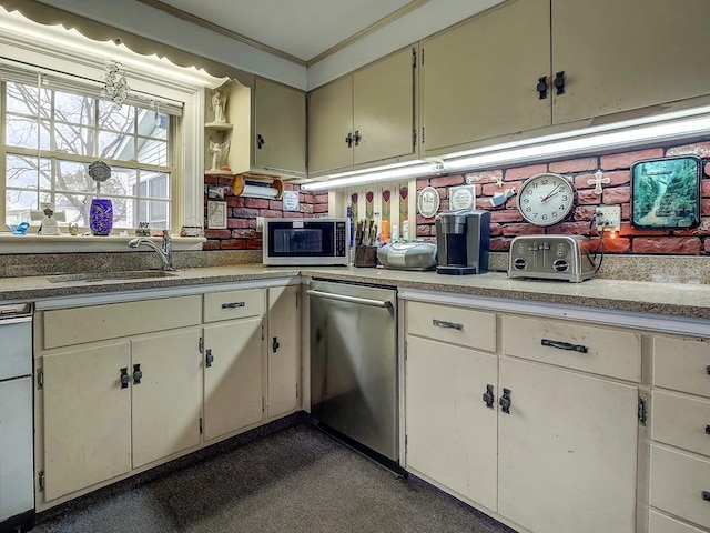 kitchen featuring white cabinets, appliances with stainless steel finishes, crown molding, and sink