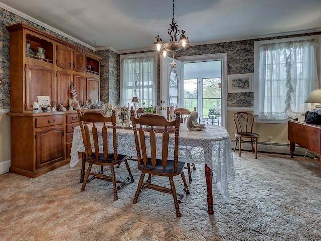 carpeted dining space featuring an inviting chandelier, ornamental molding, and a baseboard heating unit