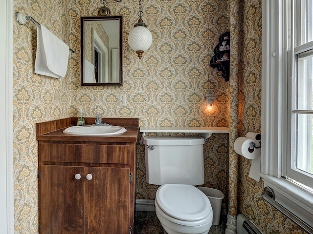 bathroom with vanity, a baseboard radiator, and toilet