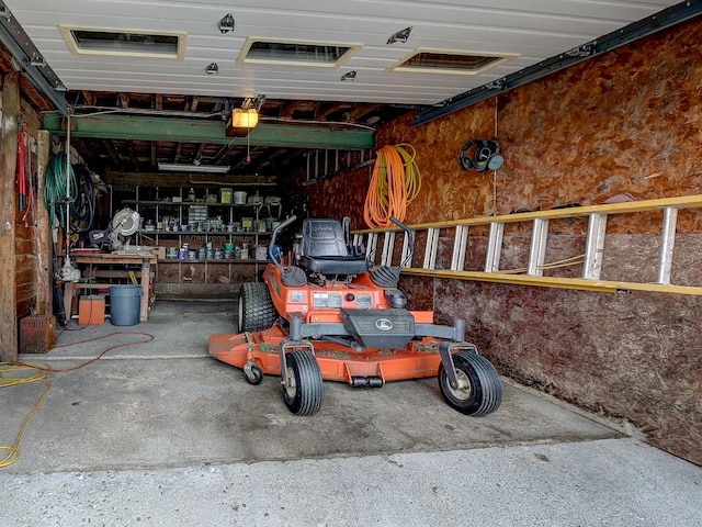 garage featuring a workshop area and a garage door opener