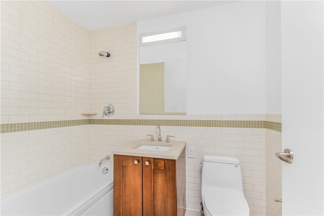 bathroom with vanity, toilet, and tile walls