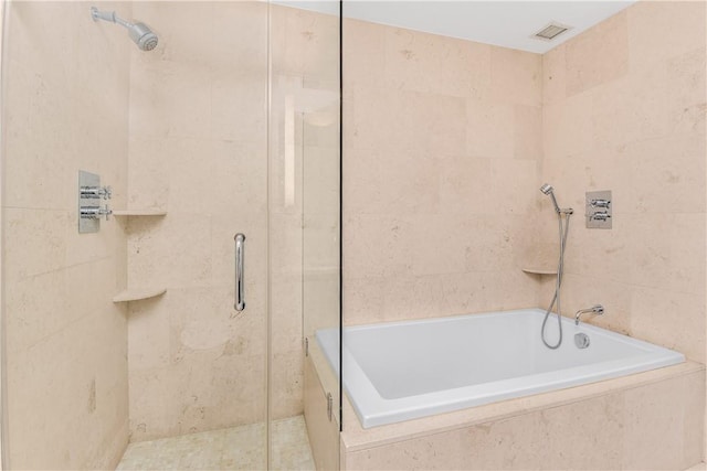 bathroom with separate shower and tub