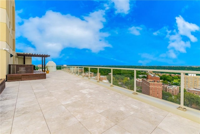 view of patio / terrace featuring a pergola and a balcony