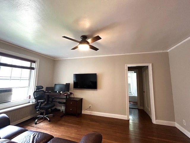 home office featuring ceiling fan, dark hardwood / wood-style flooring, ornamental molding, and radiator