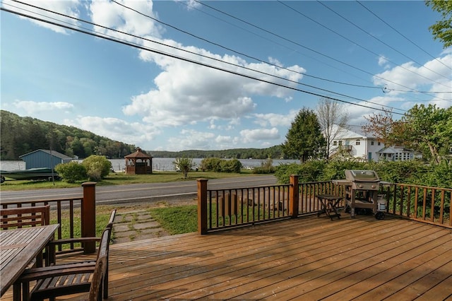 wooden deck featuring grilling area