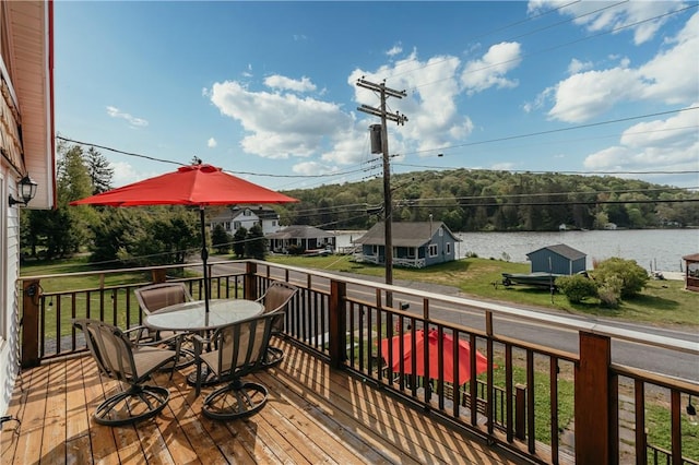 wooden terrace with a water view