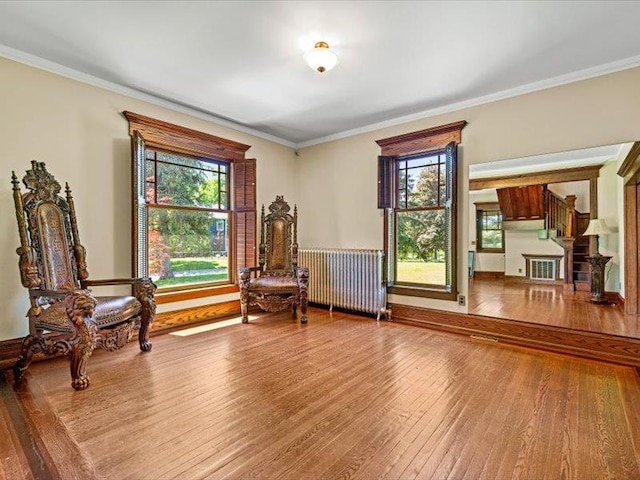 2 Pine Hill Rd, Chester, NY 10918 - sitting room featuring radiator, wood-type flooring, healthy amount of natural light, and ornamental molding