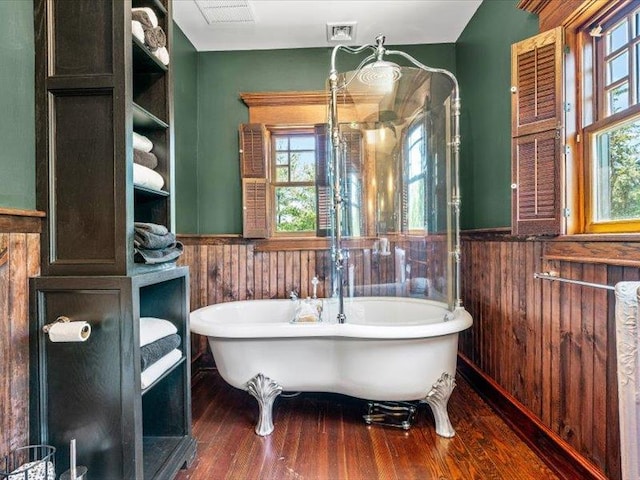 2 Pine Hill Rd, Chester, NY 10918 - bathroom featuring a wainscoted wall, wood finished floors, and a soaking tub