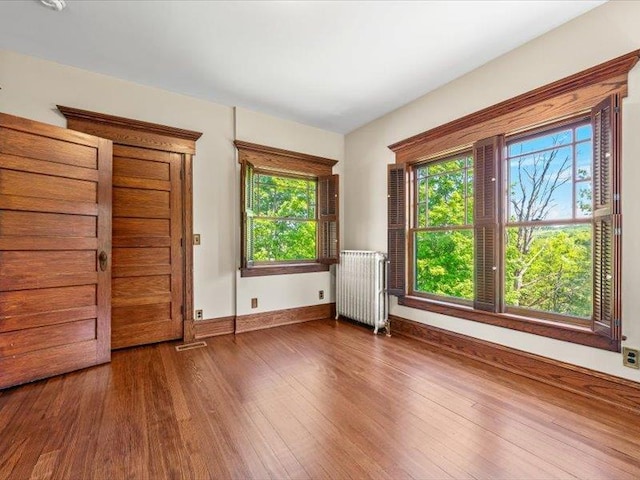 2 Pine Hill Rd, Chester, NY 10918 - unfurnished bedroom featuring radiator, wood finished floors, and baseboards