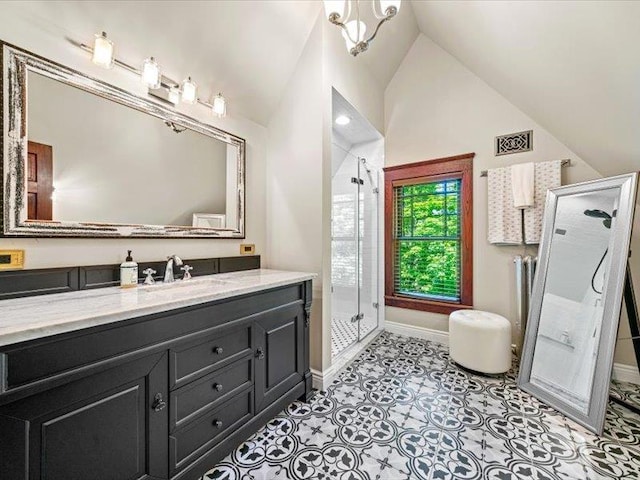 2 Pine Hill Rd, Chester, NY 10918 - bathroom with lofted ceiling, a shower stall, vanity, baseboards, and tile patterned flooring
