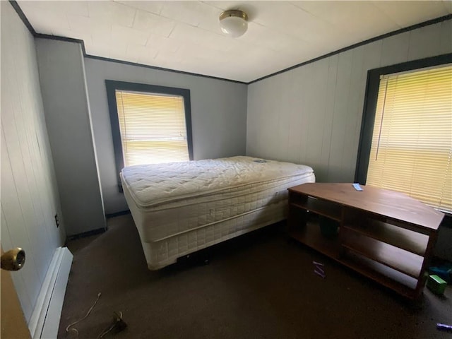 bedroom featuring wood walls