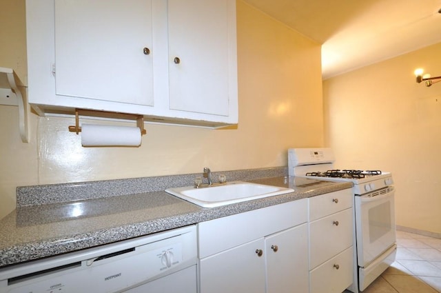 kitchen with white cabinets, light tile patterned floors, white appliances, and sink