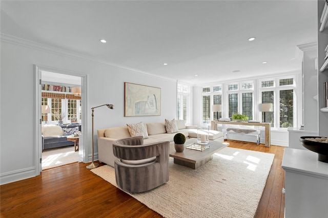 living room featuring light hardwood / wood-style flooring and ornamental molding