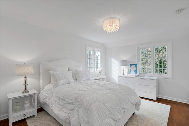 bedroom featuring dark hardwood / wood-style flooring