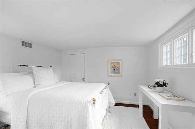 bedroom with hardwood / wood-style floors