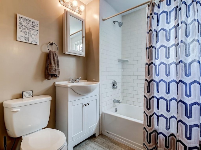 full bathroom featuring vanity, hardwood / wood-style flooring, toilet, and shower / bathtub combination with curtain