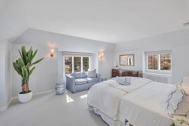 bedroom with carpet flooring, visible vents, baseboards, vaulted ceiling, and radiator