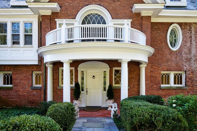 doorway to property featuring a balcony