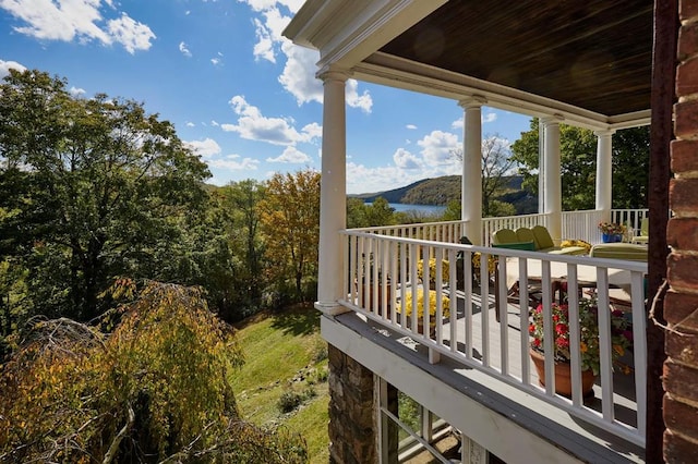 wooden deck with a water view