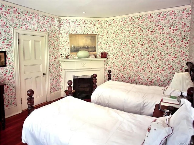 bedroom with dark hardwood / wood-style floors