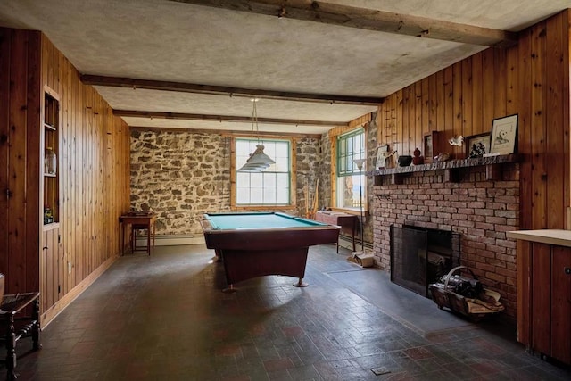 game room with baseboard heating, beamed ceiling, billiards, wood walls, and a fireplace