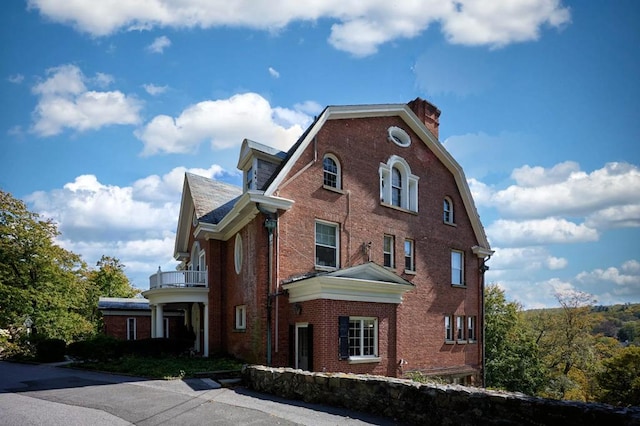 view of home's exterior featuring a balcony