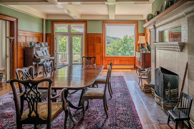 74 Tower Hill Loop, Tuxedo Park, NY 10987 - dining area featuring beamed ceiling, coffered ceiling, a wainscoted wall, healthy amount of natural light, and a baseboard heating unit