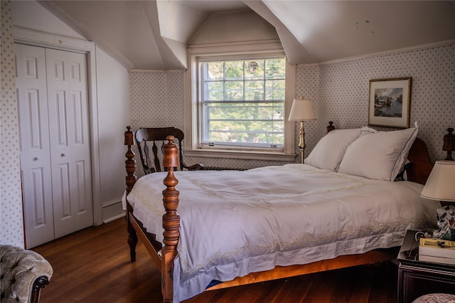 74 Tower Hill Loop, Tuxedo Park, NY 10987 - bedroom featuring vaulted ceiling, wood finished floors, wallpapered walls, and a closet