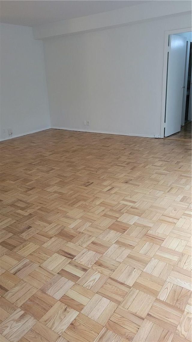 spare room featuring light parquet floors