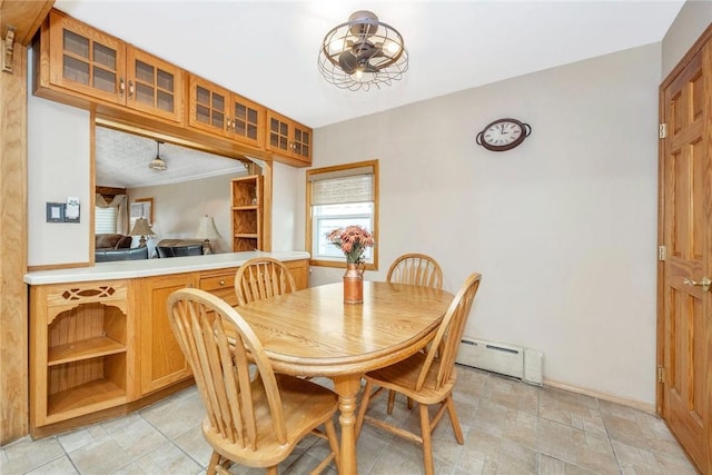 dining area with a baseboard heating unit