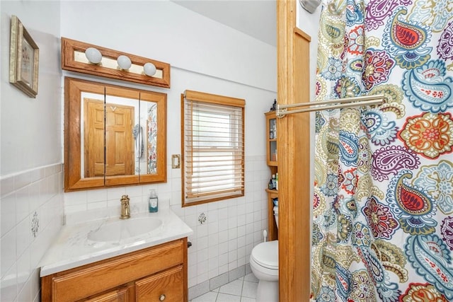 143D Edgewater Park Unit D, Bronx, NY 10465 - full bathroom with vanity, tile walls, tile patterned flooring, and toilet