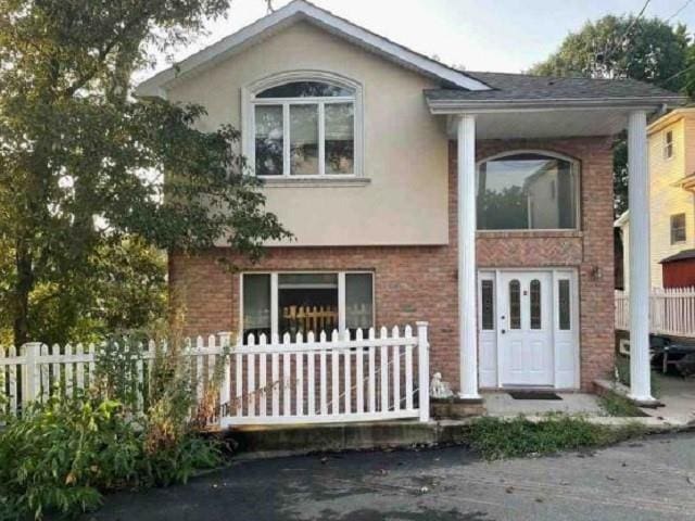 99 Excelsior Ave, Staten Island, NY 10309 - view of front of house with stucco siding and brick siding