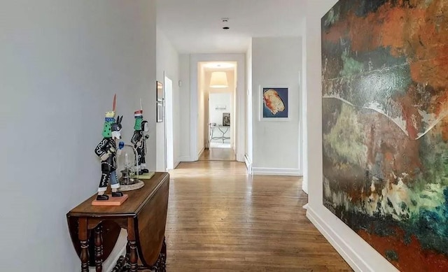 hallway featuring wood-type flooring