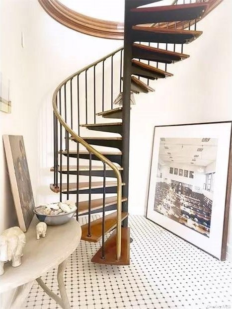 stairs featuring crown molding and carpet floors