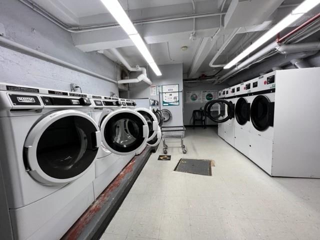 clothes washing area featuring separate washer and dryer