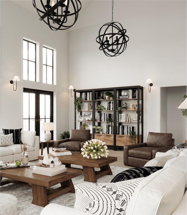 living room featuring a high ceiling, a notable chandelier, and a healthy amount of sunlight