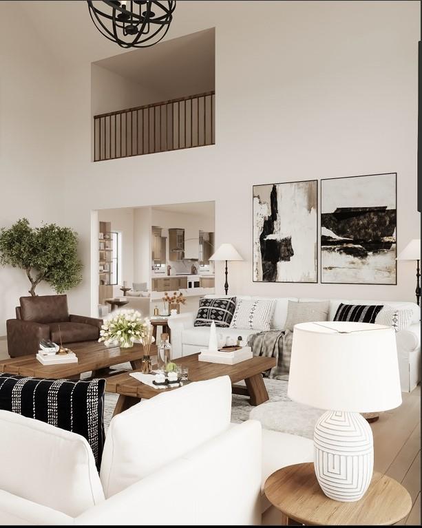 living room with a high ceiling and a notable chandelier