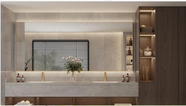 bathroom featuring tile walls and sink